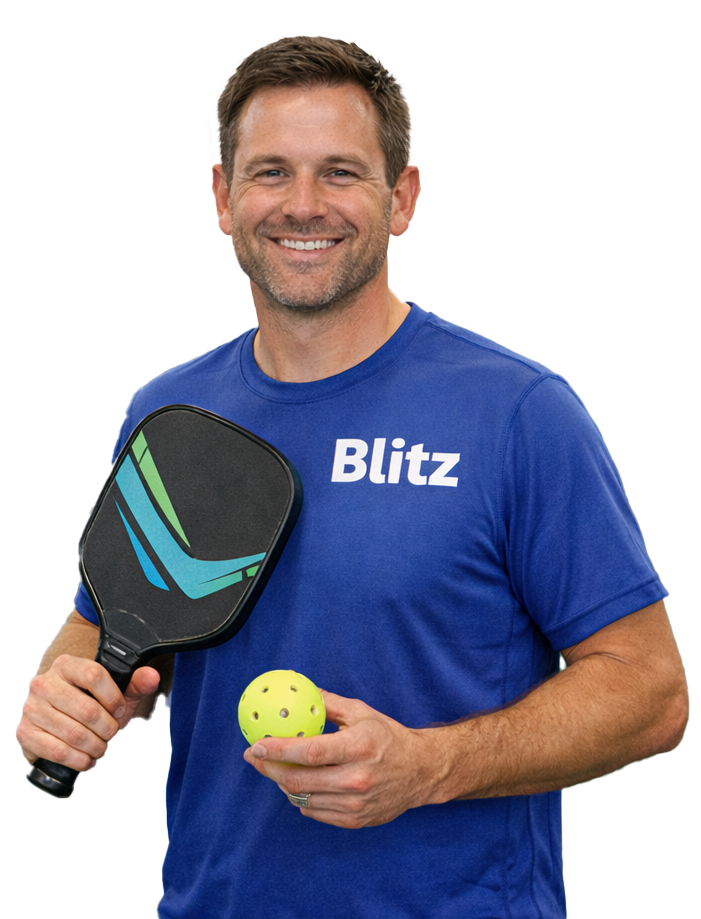 Pickleball player mid-swing at Blitz Sports Center's indoor pickleball courts